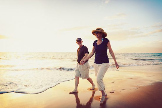 Man And Woman Walking On Seaside— Property Lawyers In Central Coast, NSW