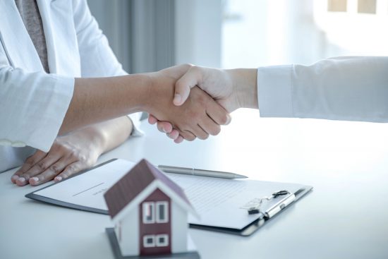 A Property Lawyer Handshake A Client